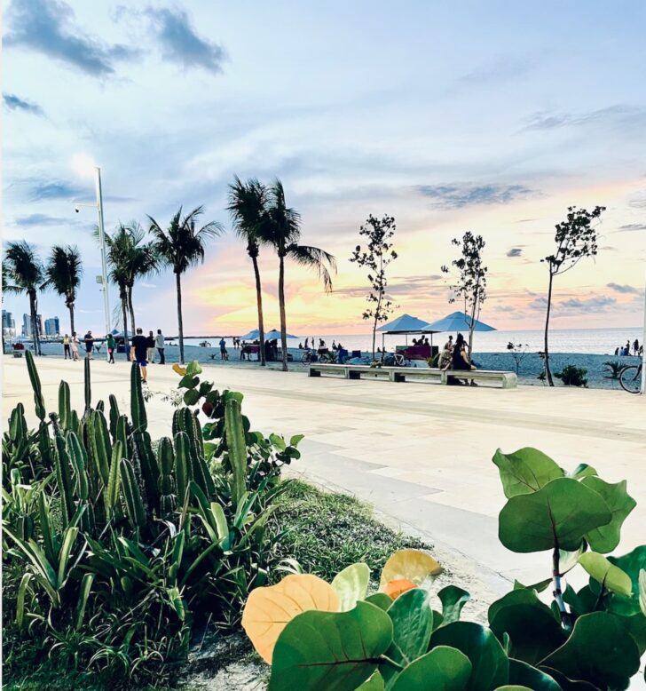 Beira Mar promenade at sunset in Fortaleza, with palm trees, coastal gardens and people along the waterfront